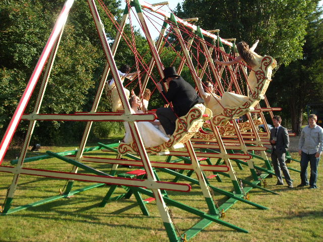 Swingboats - swing boats for hire. Traditional, victorian fairground attraction. Rent a traditional funfair swing for your party or corporate event. 